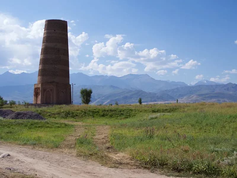The Burana tower against the mountains